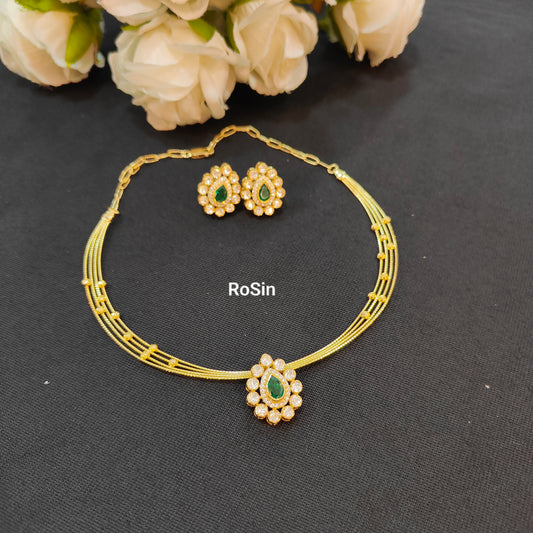Four line royal kanti with kundhan green pendant and earrings set