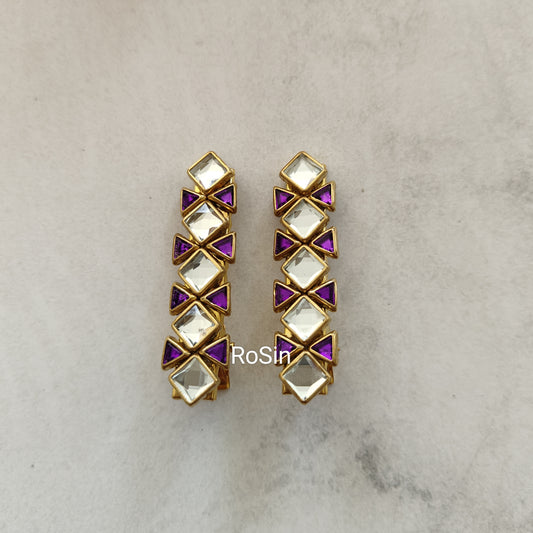 White and purple alligator clip