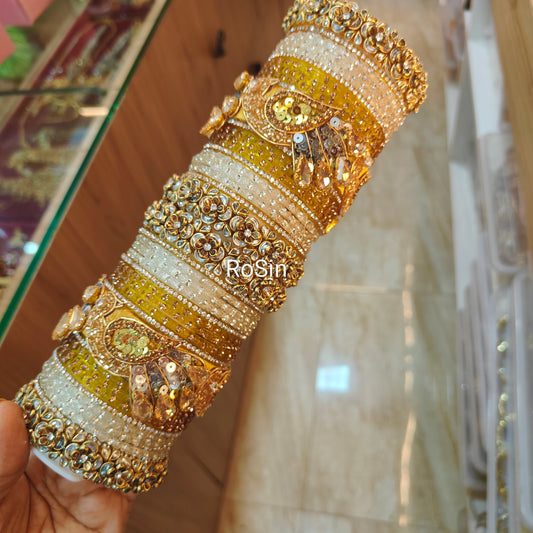 Intricate golden and white peacock set