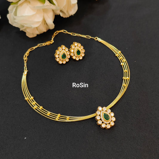 Four line royal kanti with kundhan green pendant and earrings set